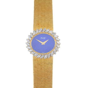 PIAGET - a lady's diamond watch. The oval-shape dyed: PIAGET - a lady's diamond watch. The oval-shape dyed lapis lazuli dial, with marquise-shape diamond border, to the textured tapered bracelet. Estimated total diamond weight 2cts. Length 18.5cms. Total