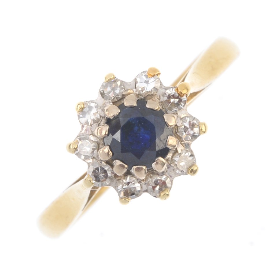 An 18ct gold sapphire and diamond cluster ring. The (1 of 1)
