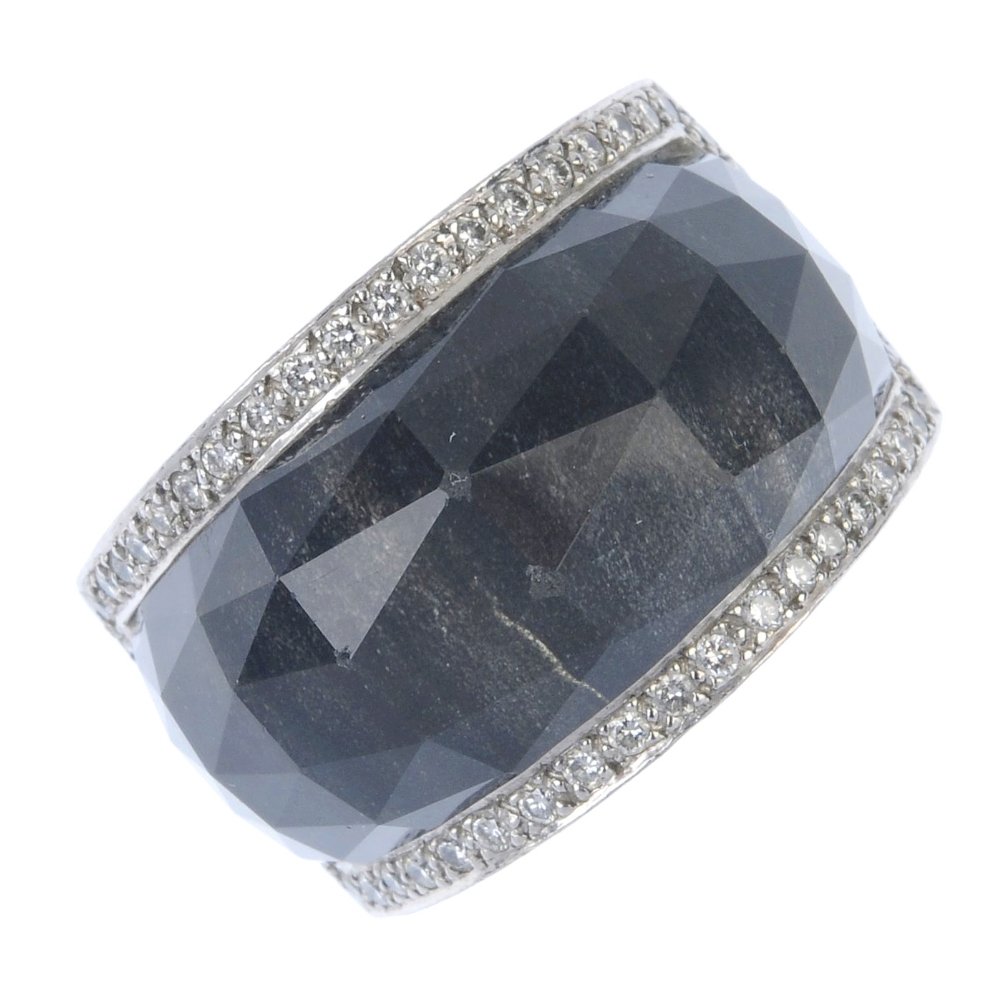 (542519-1-A) STEPHEN WEBSTER - an 18ct gold 'classic: (542519-1-A) STEPHEN WEBSTER - an 18ct gold 'classic crystal haze' ring. The haematite and faceted rock crystal panel, within a brilliant-cut diamond surround, to the grooved and shaped band. Maker's