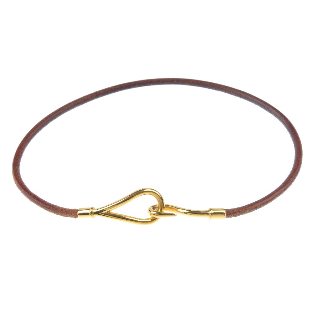 HERMES - a cord bracelet. The brown leather cord to the (1 of 3)