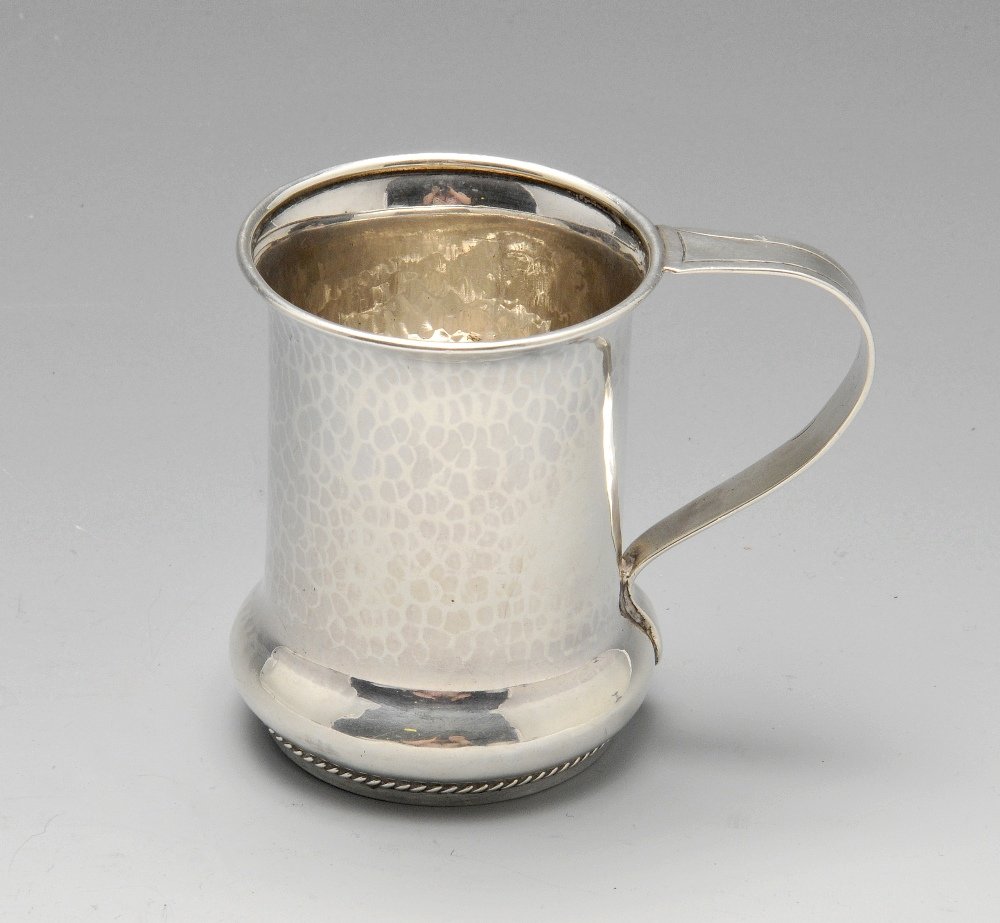 An early twentieth century small silver mug, the (1 of 3)