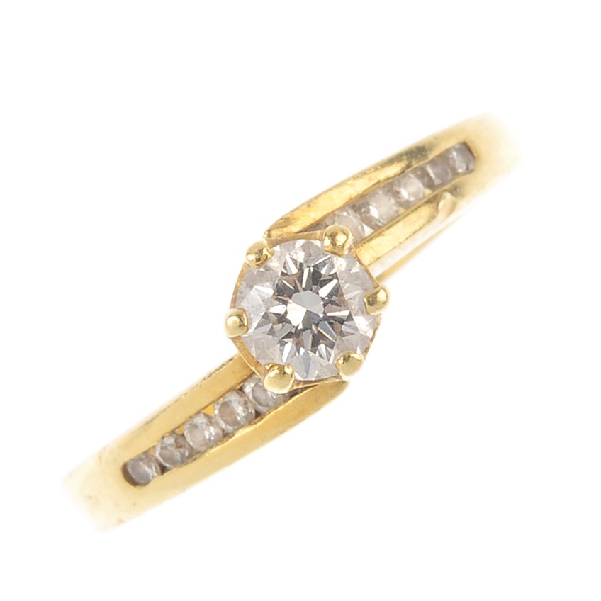 A diamond single-stone crossover ring. The (1 of 3)