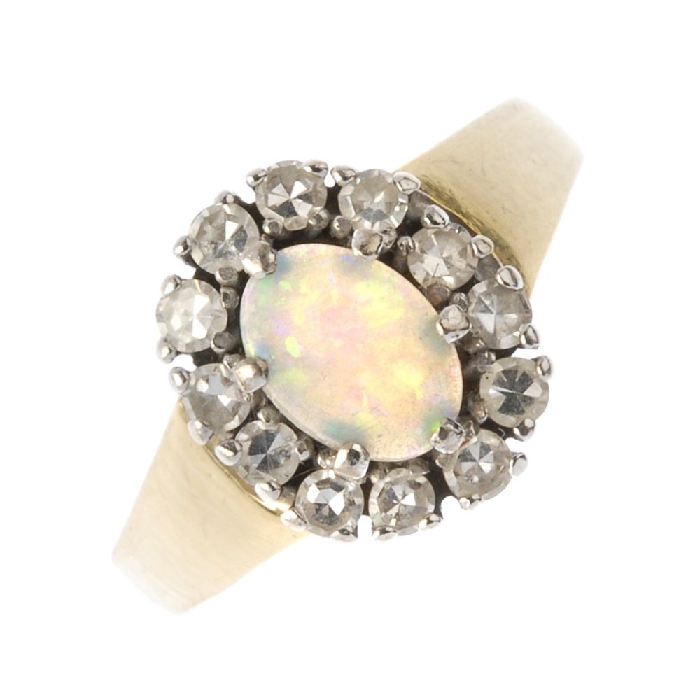 An 18ct gold opal and diamond cluster ring. The oval (1 of 3)
