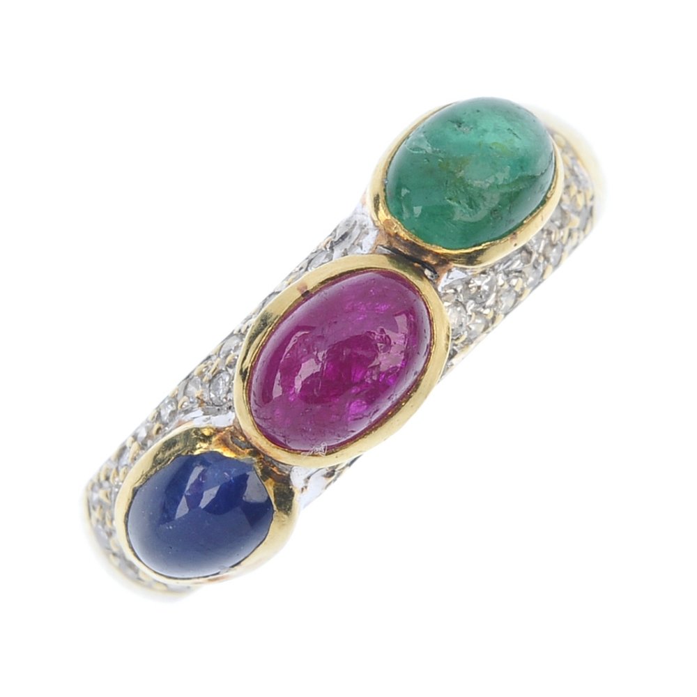 A diamond and gem-set dress ring. The oval emerald, (1 of 3)
