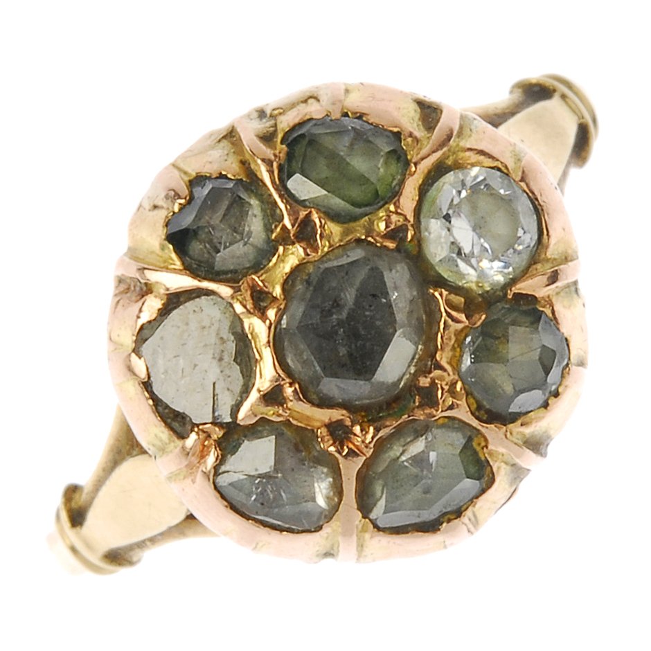 A diamond cluster ring. Designed as a rose-cut diamond (1 of 3)