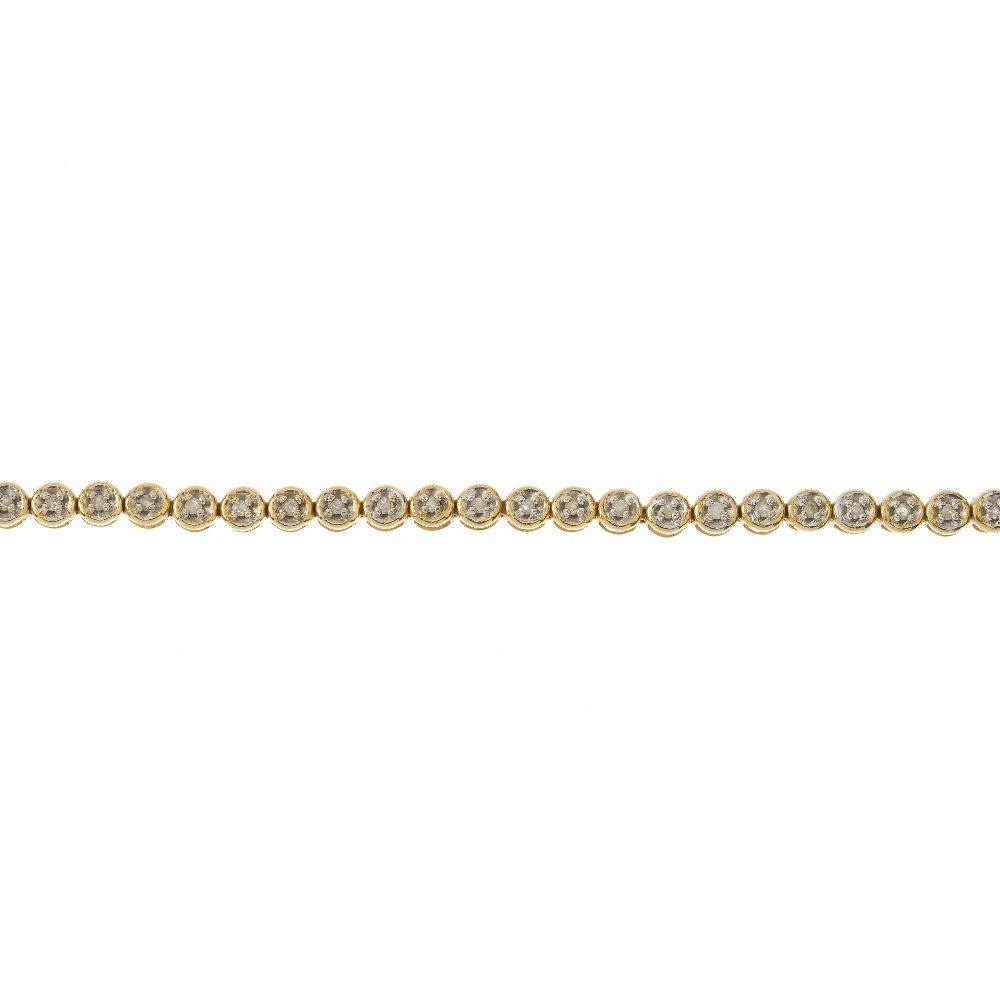 A 9ct gold diamond bracelet. Designed as a series of (1 of 3)