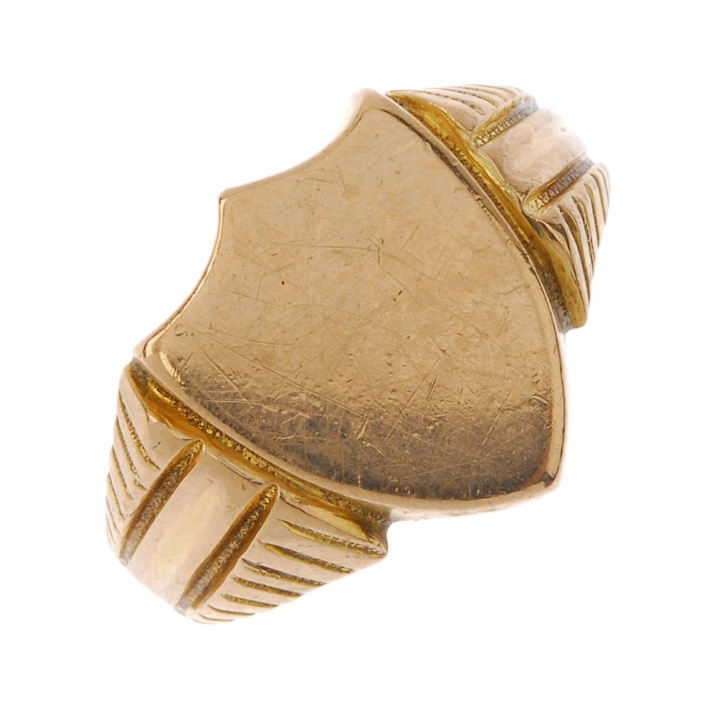 An early 20th century 9ct gold signet ring. The (1 of 3)
