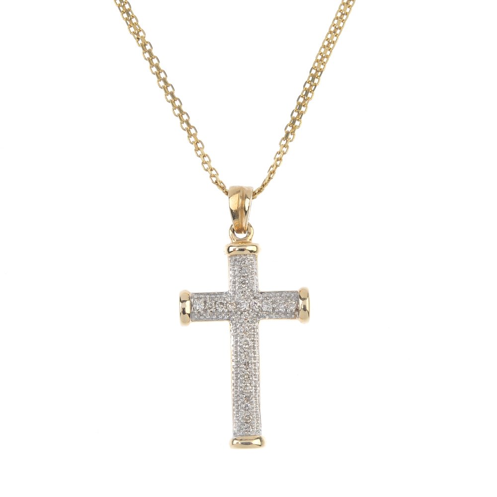 A diamond cross pendant, with chain. The pave-set (1 of 2)