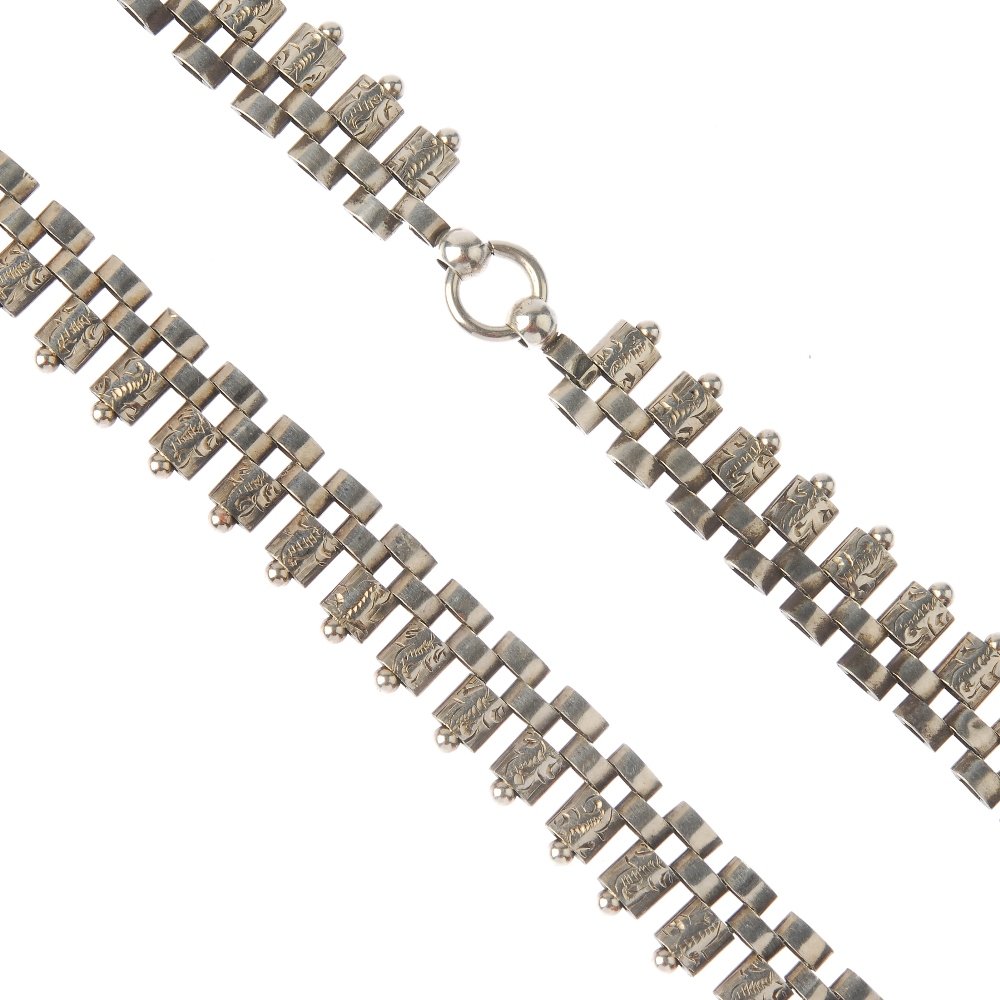 A late Victorian silver collar. Comprising engraved (1 of 2)