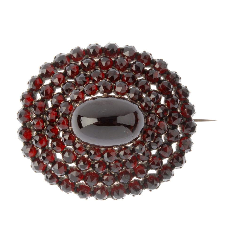 A late 19th century garnet and paste brooch. The (1 of 2)