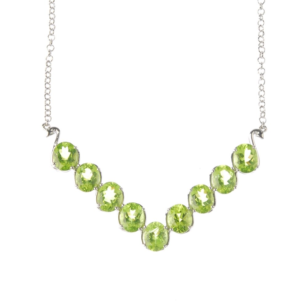 Three items of gem jewellery. To include a peridot (1 of 2)