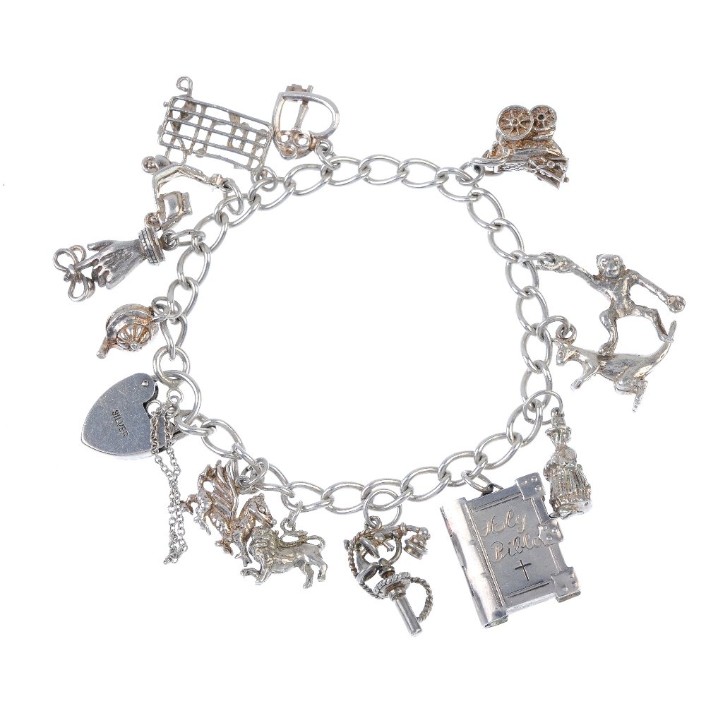 Five charm bracelets. The five curb-link chains: Five charm bracelets. The five curb-link chains suspending a total of forty-six charms, to include a monkey charm and a set of bagpipes. Lengths 16 to 18cms. Weight 190.8gms. This lot is in fair condi