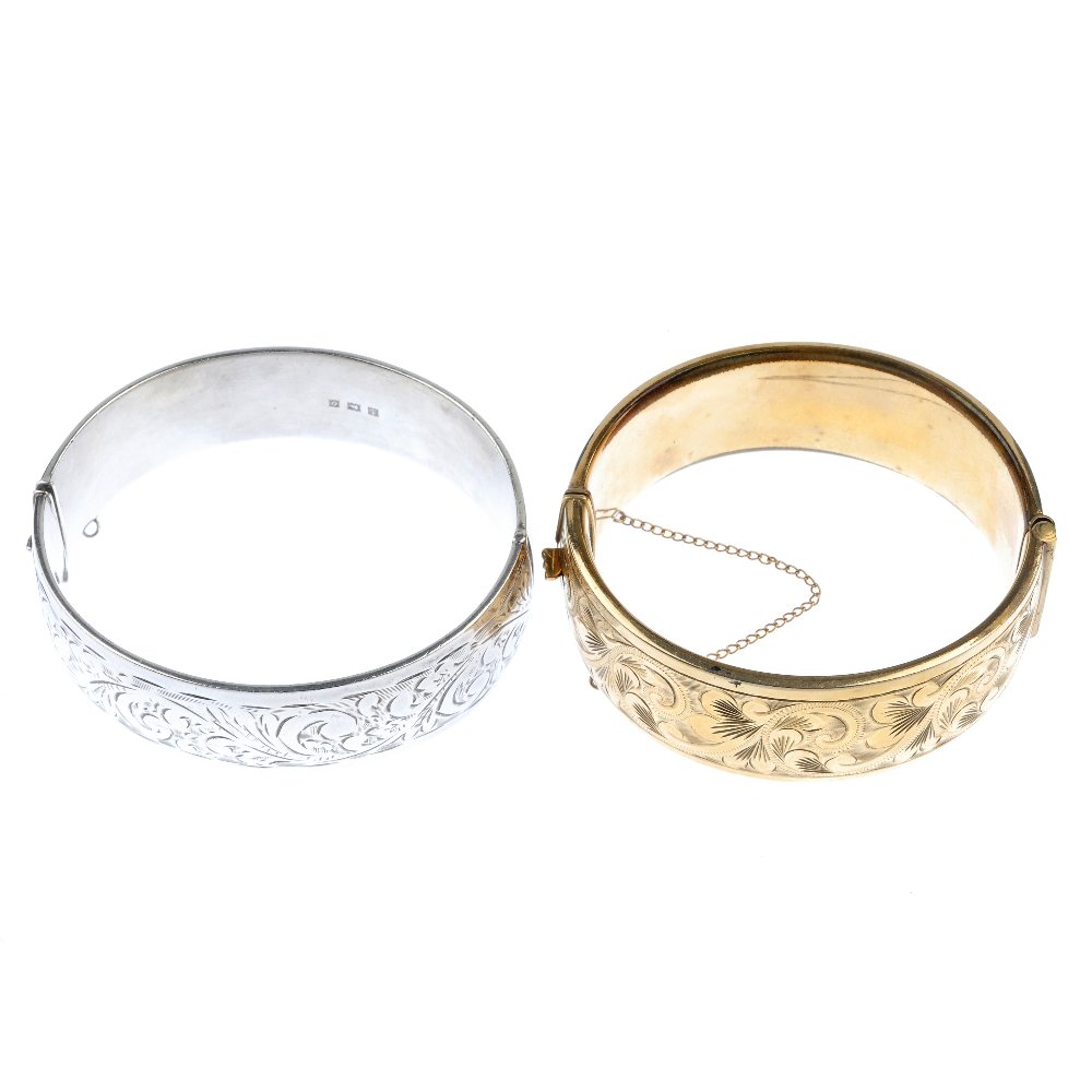 Two hinged bangles. Both engraved with acanthus to the (1 of 2)