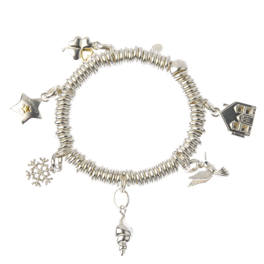 LINKS OF LONDON - two 'Sweetie' charm bracelets. One: LINKS OF LONDON - two 'Sweetie' charm bracelets. One with five gold-tone links and together suspending twelve charms, including cupid holding a gold-tone heart and a humming bird charm. With maker's m