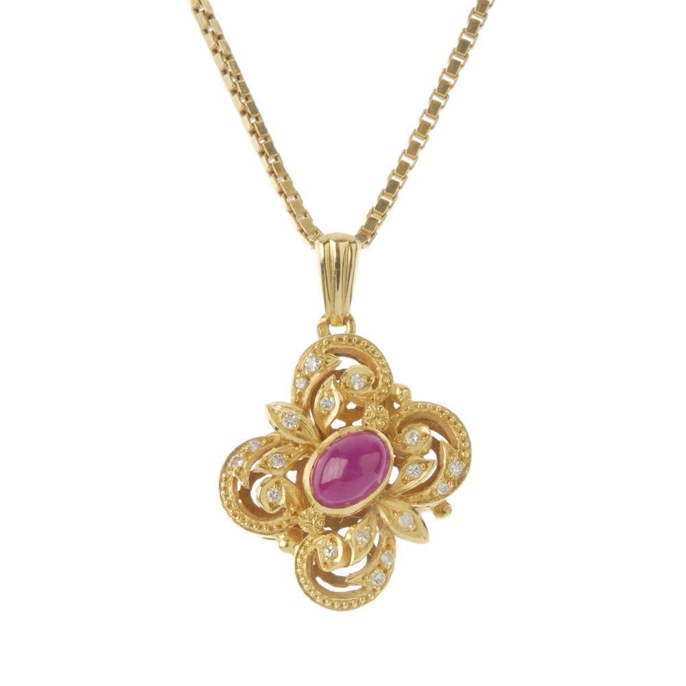 A ruby and diamond pendant. Of floral design, the oval (1 of 2)