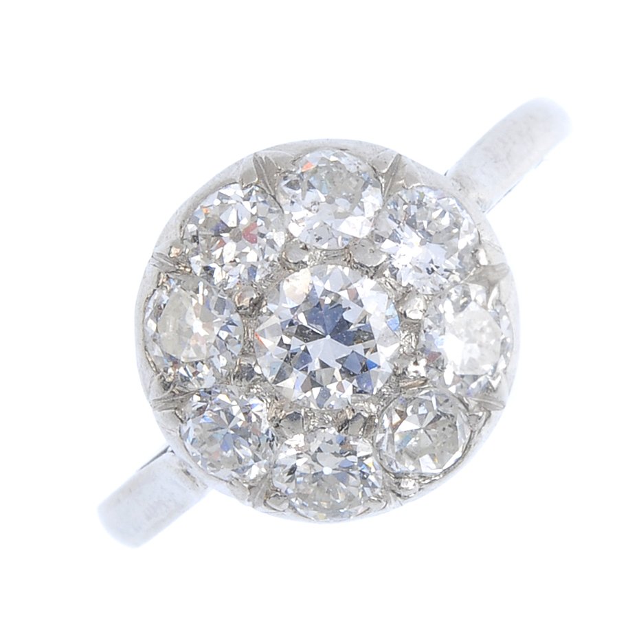 A mid 20th century platinum diamond cluster ring. The (1 of 3)