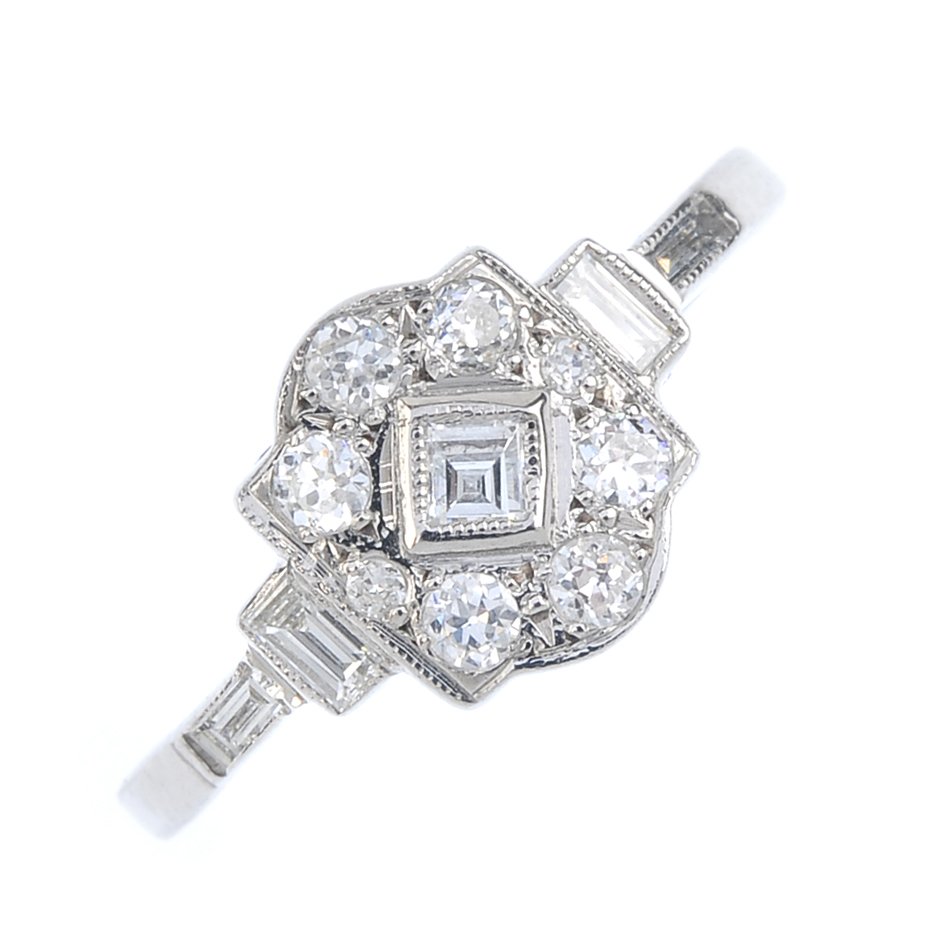 A diamond dress ring. Of geometric design, inset with (1 of 3)