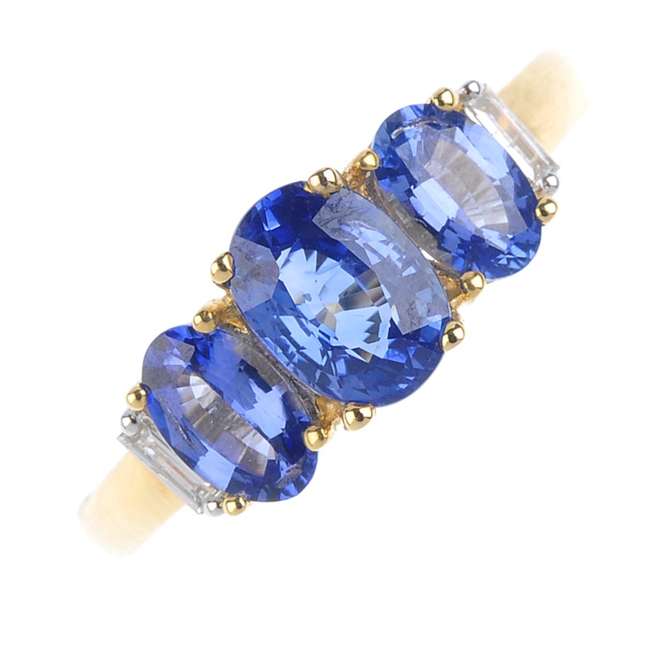 An 18ct gold Ceylon sapphire and diamond ring. The (1 of 3)