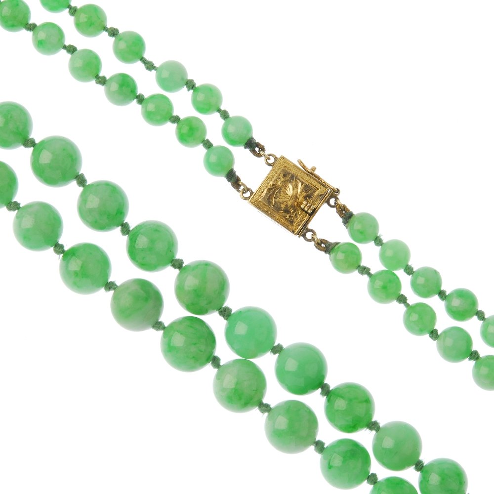 A jadeite two-row necklace. Comprising two rows of (1 of 3)