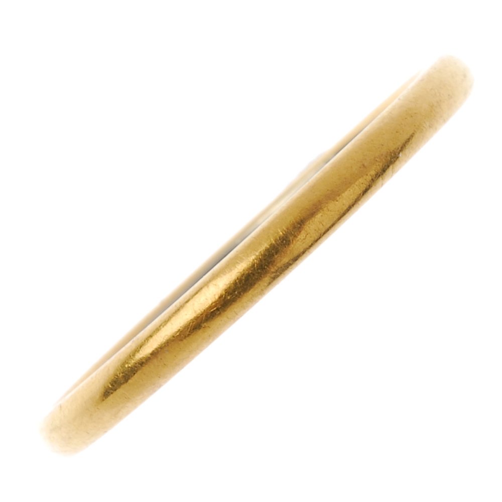 An early 20th century 22ct gold and platinum band ring. (1 of 2)