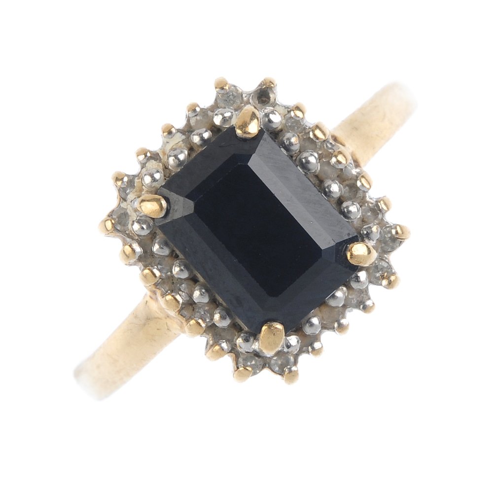 A gem-set ring and earrings. The ring designed as a (1 of 3)