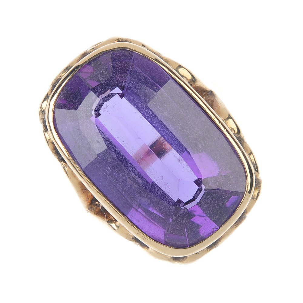 A synthetic colour change sapphire single-stone ring. (1 of 3)