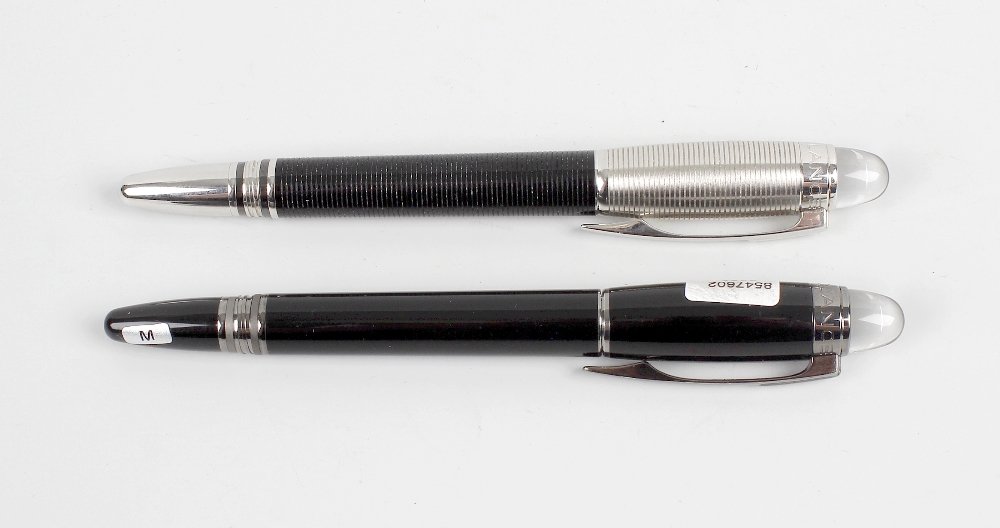 A Montblanc Starwalker fountain pen, having black resin: A Montblanc Starwalker fountain pen, having black resin body and dark grey clip and banding, domed terminal with white star emblem, together with a Montblanc Meisterstuck pen, having ribbed black resi