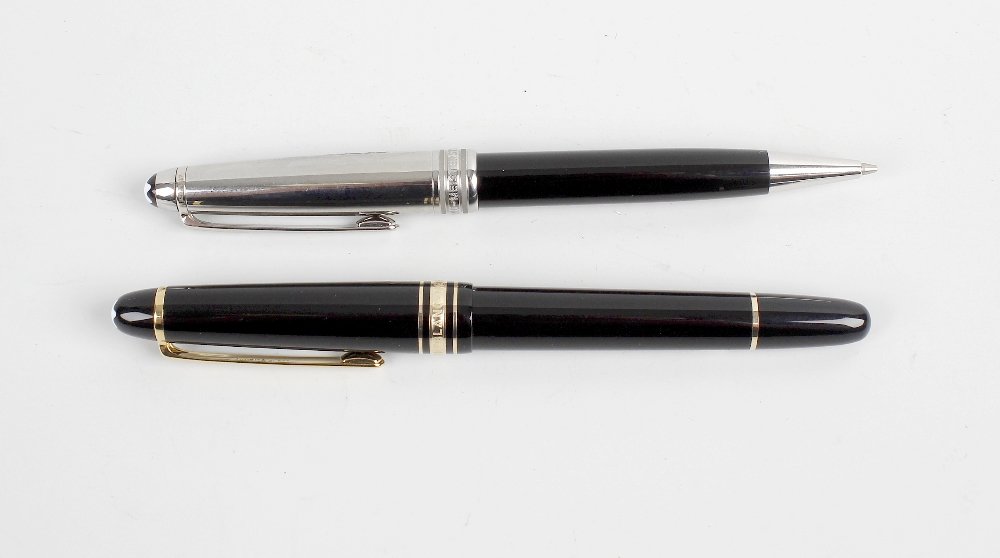 A Montblanc Meisterstuck fountain pen, having 18K: A Montblanc Meisterstuck fountain pen, having 18K '4810' Montblanc nib, the black resin body with gold coloured clip and banding, the domed terminal with white star emblem, together with a Montblanc M
