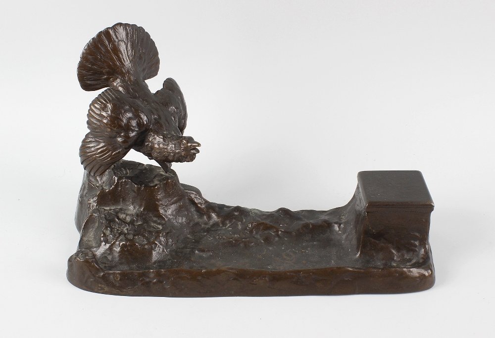 An unusual early 20th century bronzed desk stand: An unusual early 20th century bronzed desk stand modelled as a turkey upon a naturalistic modelled 'pen tray' base, supporting a concealed covered inkwell with clear glass liner, 13.5 x 7.5 (34cm x 18