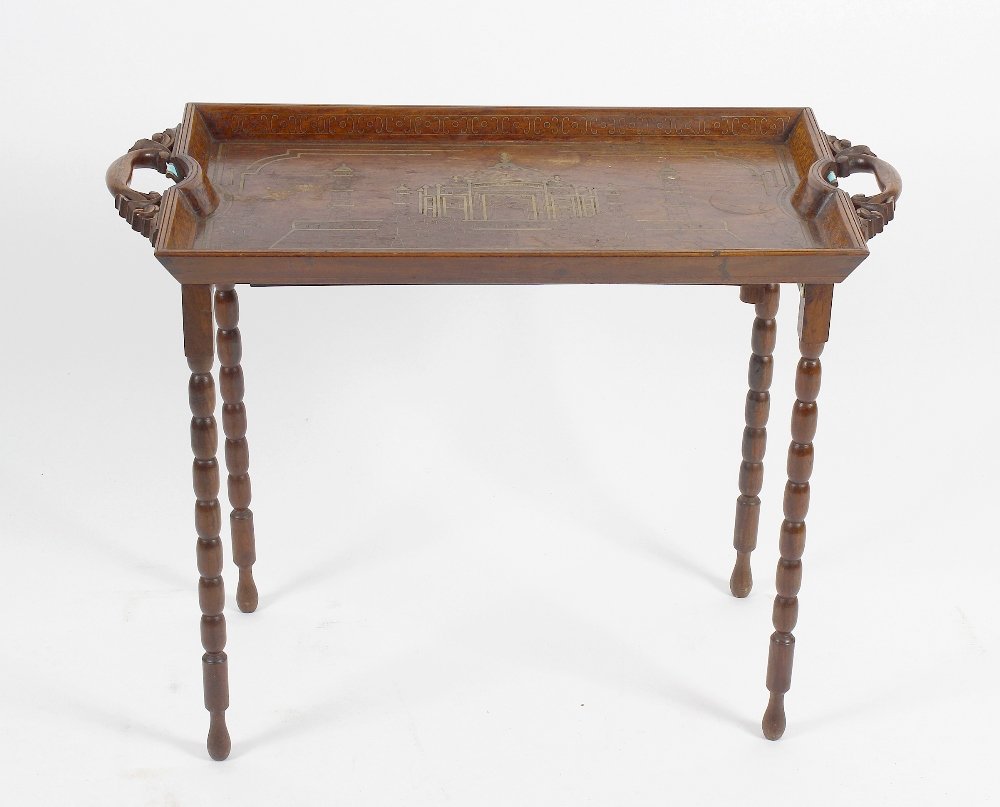 A box containing a soapstone figure modelled as a: A box containing a soapstone figure modelled as a Buddha seated upon a lotus flower, together with a set of resin three wise monkey figures, a selection of assorted wooden stands, and an Indian tray-t