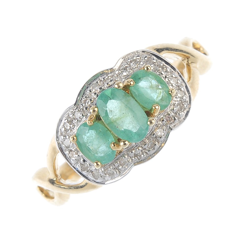 A 9ct gold emerald and diamond cluster ring. The (1 of 3)