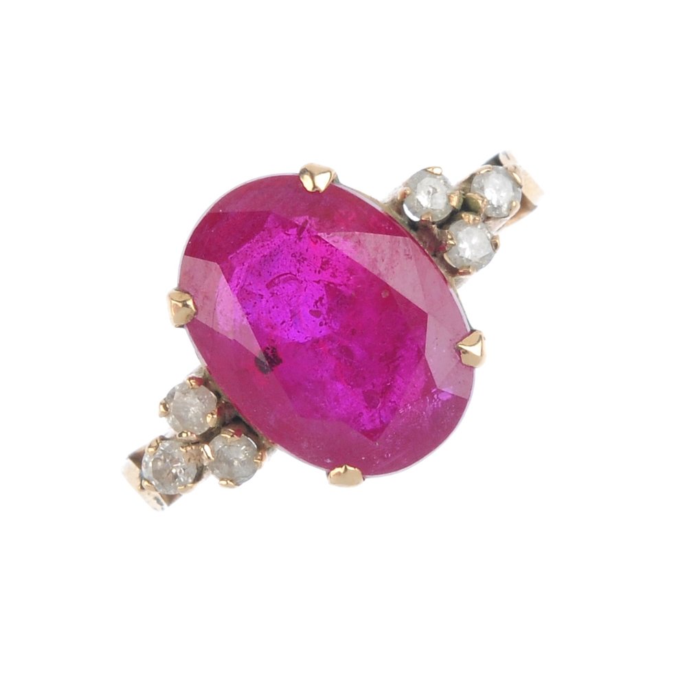 A glass-filled ruby and diamond dress ring. The (1 of 3)