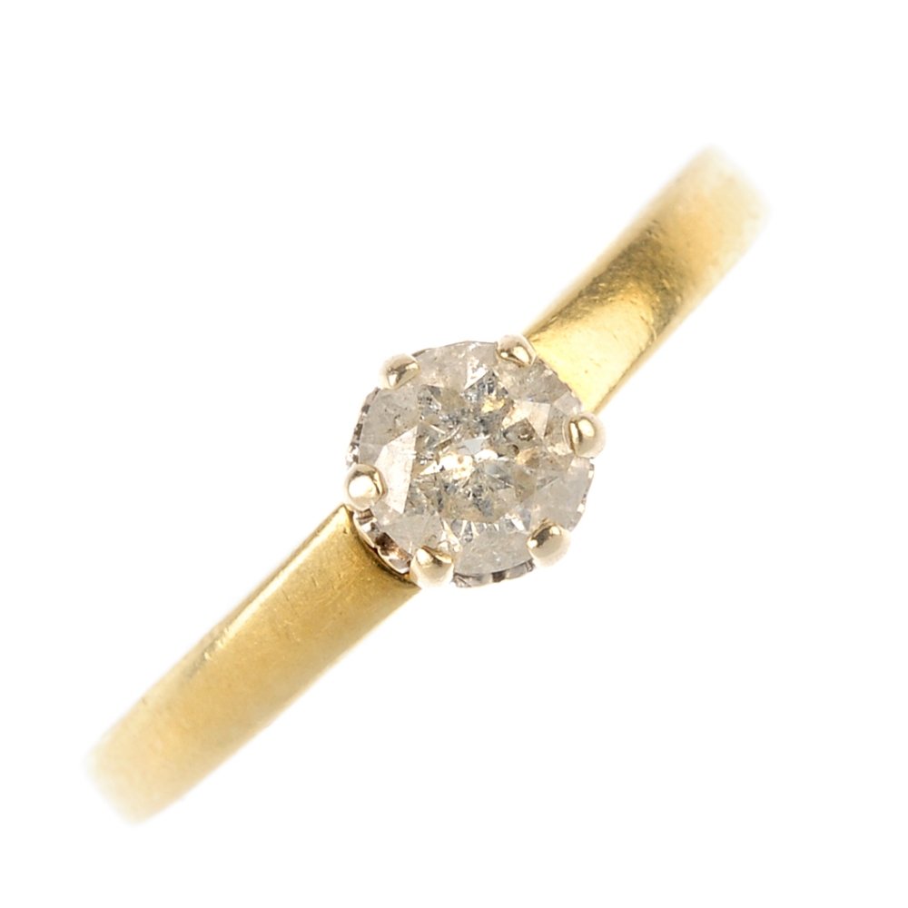 An 18ct gold diamond single-stone ring. The (1 of 3)