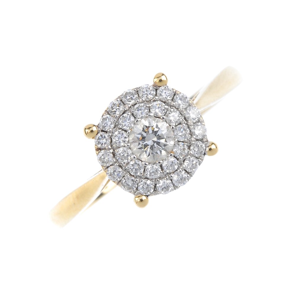 An 18ct gold diamond cluster ring. The brilliant-cut (1 of 3)