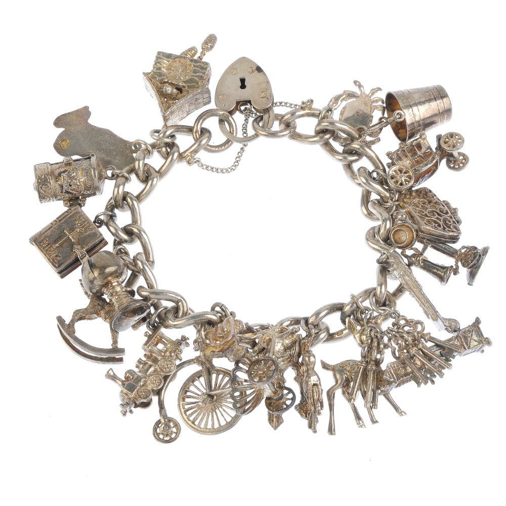 Three charm bracelets. Two curb-link and one double (1 of 2)