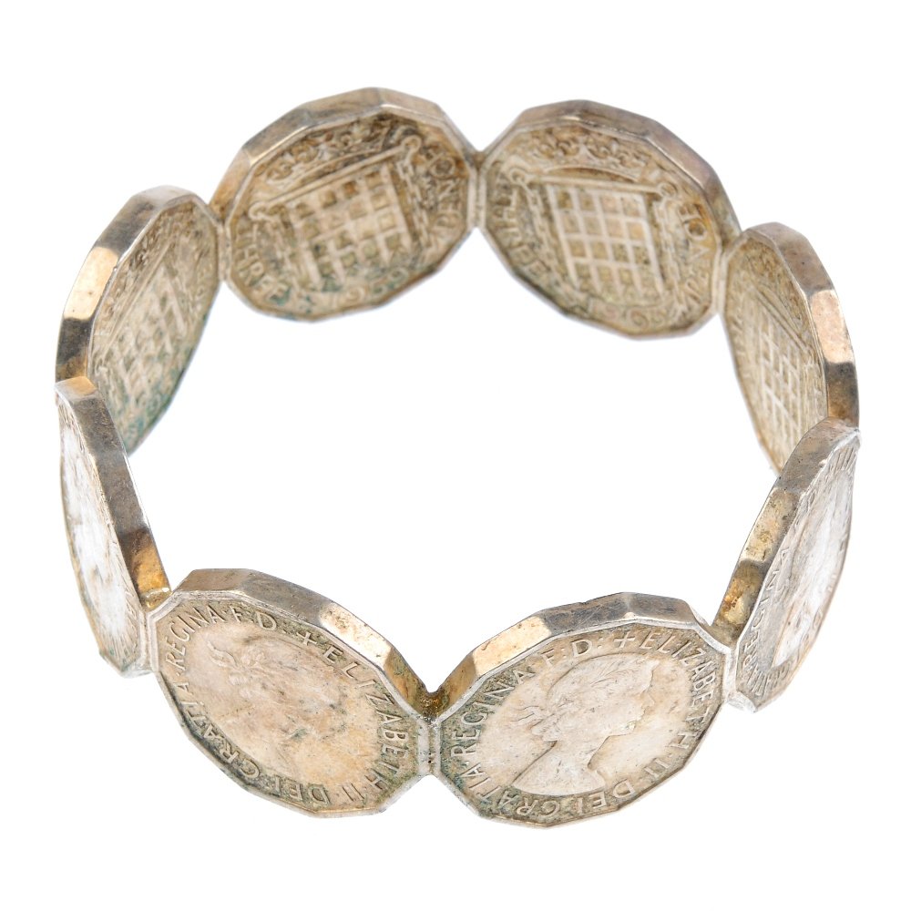 A selection of jewellery. To include a bangle set with: A selection of jewellery. To include a bangle set with malachite, to the full bangle together with a purple paste brooch. Due to the number of items in this lot, it is not possible to provide a more d