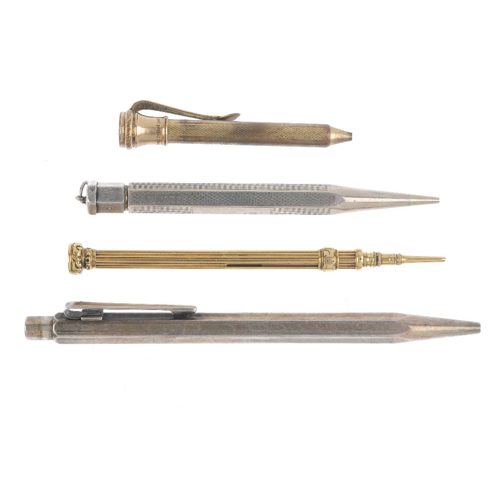 Four pens or pencils. To include a retractable pencil (1 of 4)