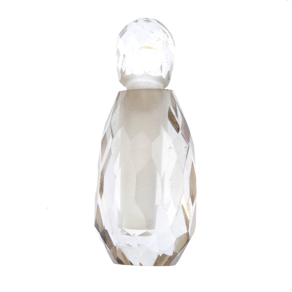 A rock crystal perfume bottle. The faceted oval bottle (1 of 3)