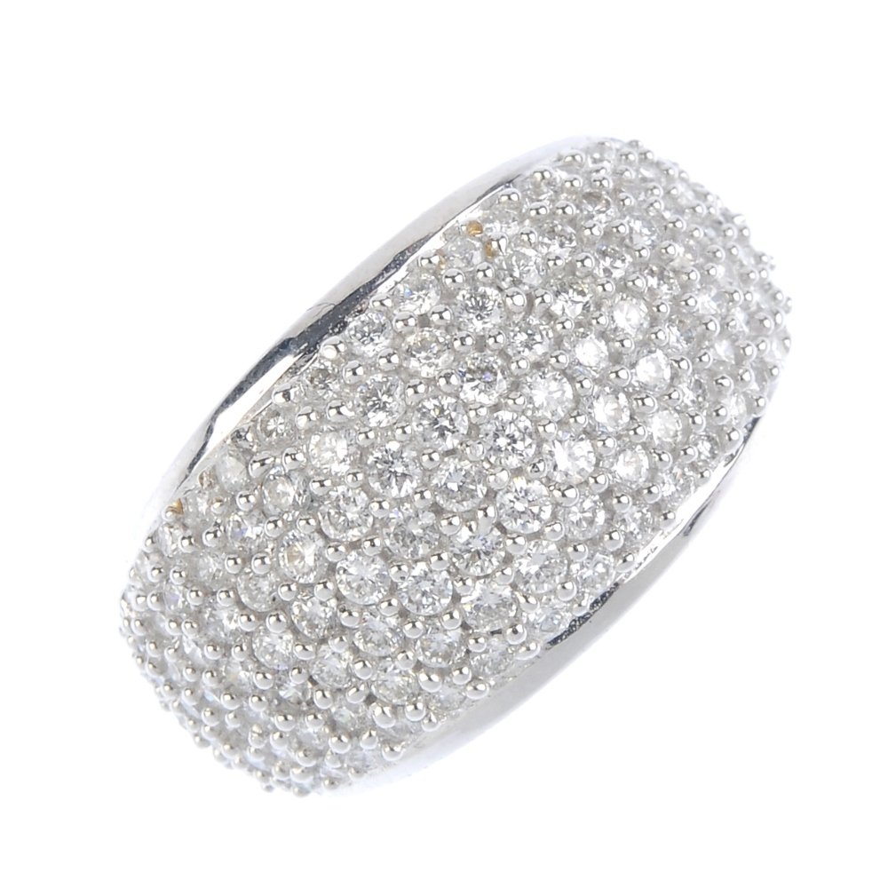 An 18ct gold diamond dress ring. The pave-set diamond (1 of 3)