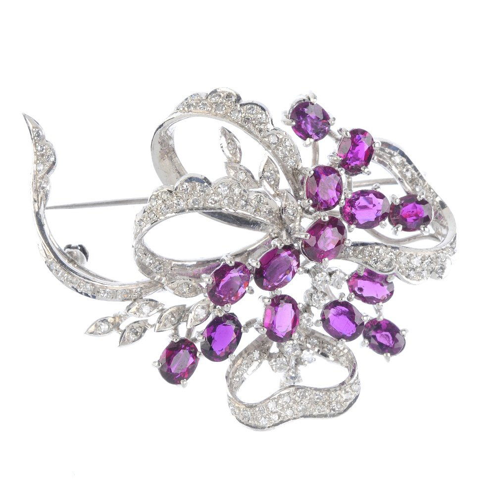 A ruby and diamond brooch. Of openwork design, the oval (1 of 2)