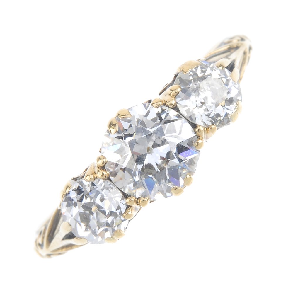 An early 20th century 18ct gold diamond three-stone (1 of 3)