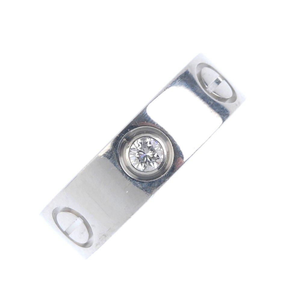CARTIER - an 18ct gold diamond 'love' ring. Designed as (1 of 3)