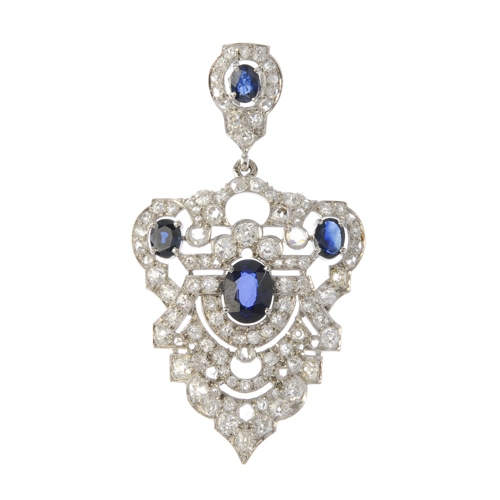 A sapphire and diamond pendant. Of geometric design, (1 of 2)