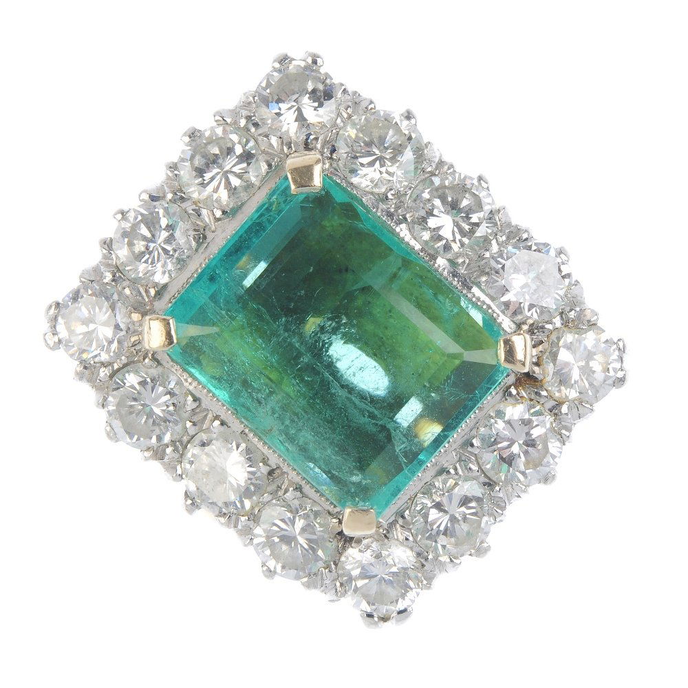 An emerald and diamond cluster ring. The (1 of 5)