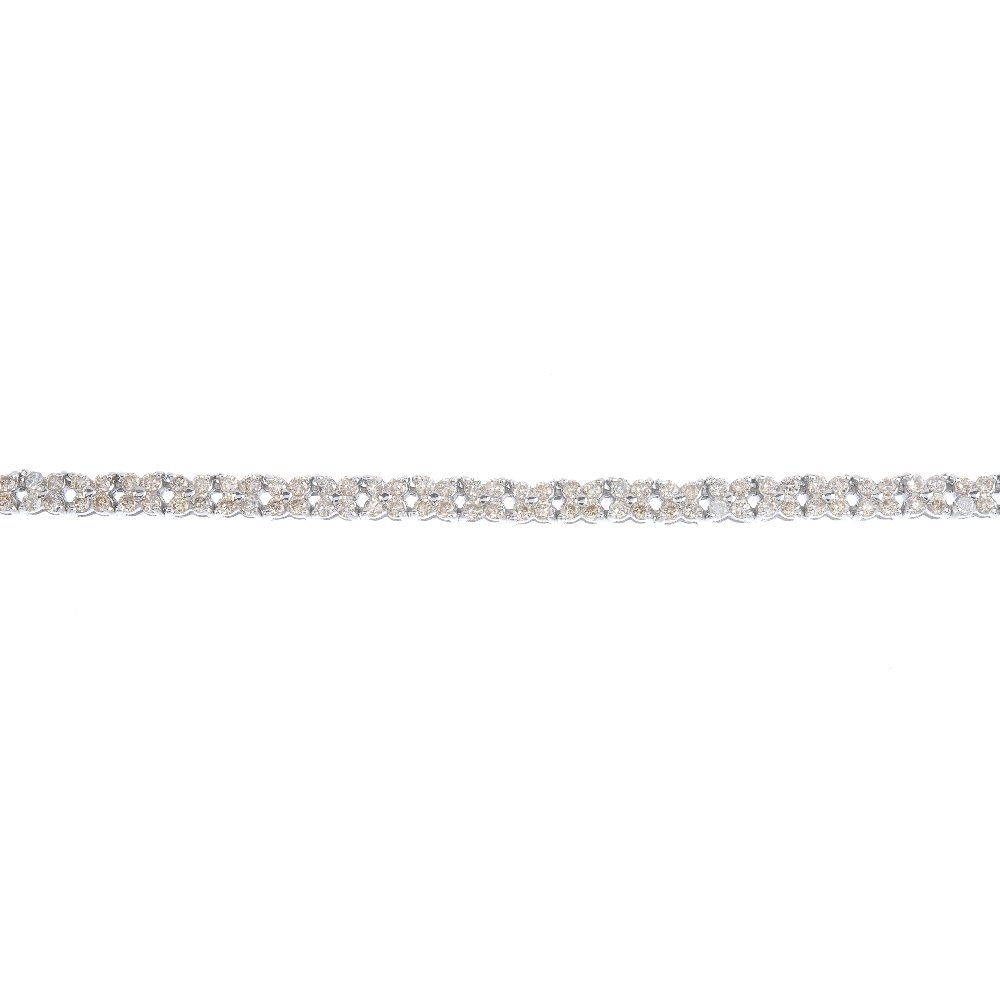 An 18ct gold diamond bracelet. Designed as a series of (1 of 3)