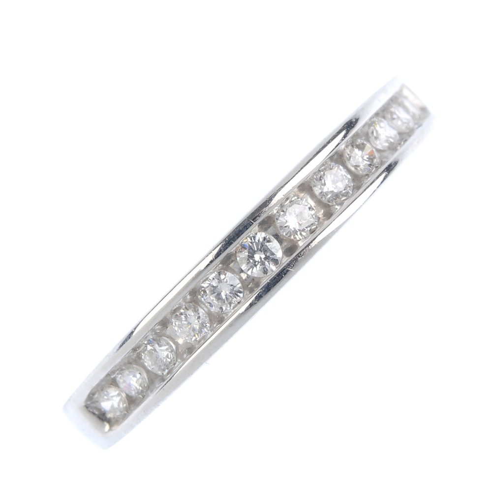 An 18ct gold diamond half-circle eternity ring. The (1 of 3)