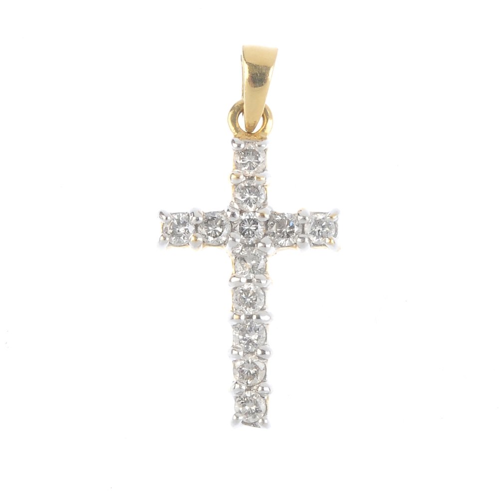 An 18ct gold diamond cross pendant. Of bi-colour (1 of 2)