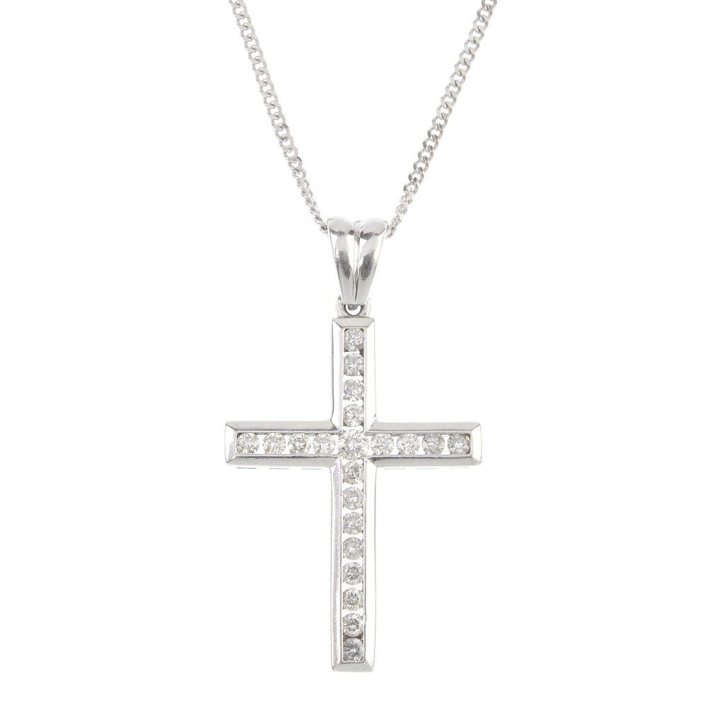 A 9ct gold diamond cross pendant, with chain. The (1 of 2)
