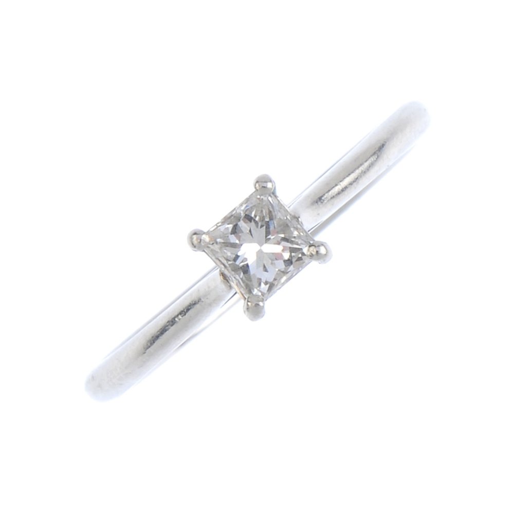 A platinum diamond single-stone ring. The square-shape (1 of 3)