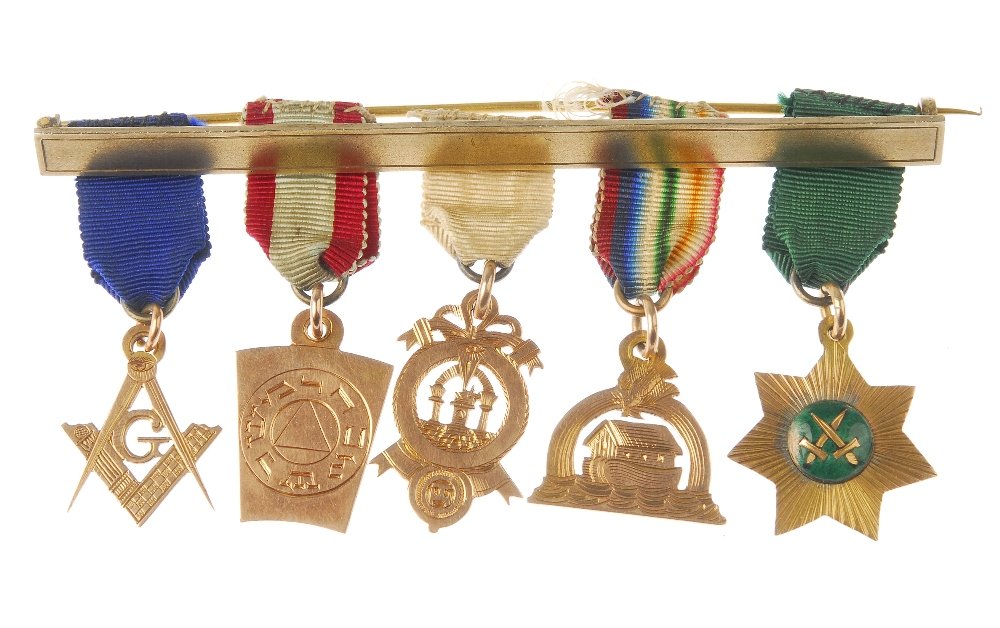 Masonic, Scotland, a mounted set of five gold: Masonic, Scotland, a mounted set of five gold miniatures, cased, bar marked Brown, Argyll Arcade, Glasgow. One marked 9ct. (5)